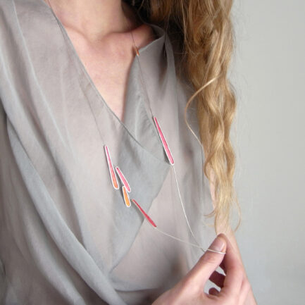 Silver feather-like long necklace with coloured paper inlay