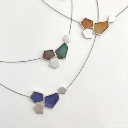 Silver rock-shaped necklace with coloured paper inlay