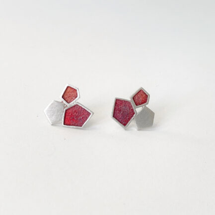 Silver rock-shaped studs with coloured paper inlay