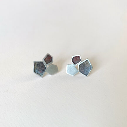 Silver rock-shaped studs with coloured paper inlay