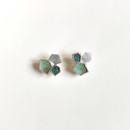 Silver rock-shaped studs with coloured paper inlay