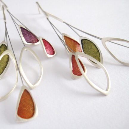 Silver leaf-shaped earrings with coloured paper inlay