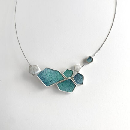 Silver rock-shaped statement necklace with coloured paper inlay