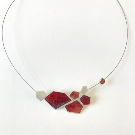 Silver rock-shaped statement necklace with coloured paper inlay