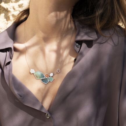 Silver rock-shaped statement necklace with coloured paper inlay